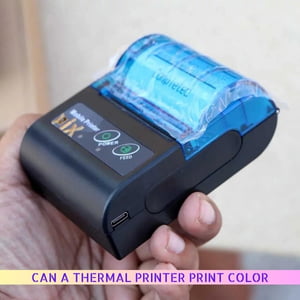 Can a Thermal Printer Print Color In 2025 5 A person holding a thermal printer in their hand, ready to print documents efficiently.