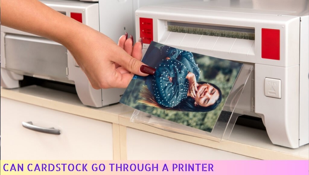 A person printing a photo using a cardstock printer.